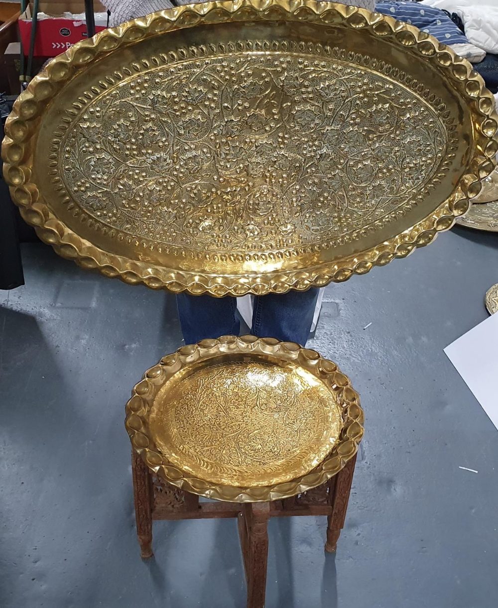 Large, very heavy, oval brass hanging, display tray together with a small ornately hammered small