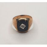 9ct yellow gold & onyx ring set with a small central diamond, Size O 4.3 grams gross