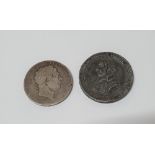 George III 1819 silver crown together with a 19thC base metal, drilled, foreign coin or medal (2)