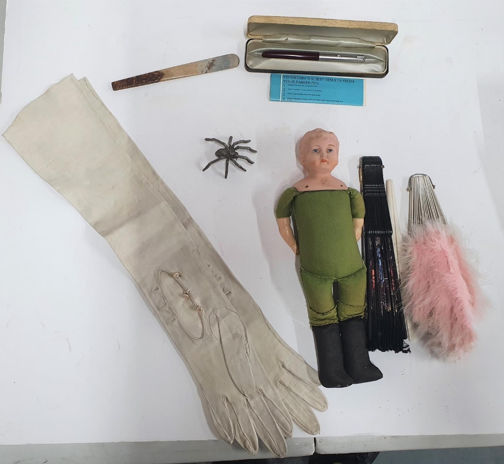 Small collection of antiques to include a doll, ladies leather glovers, a glove stretcher, metal