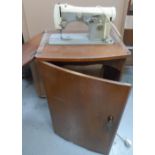 Vintage Necchi sewing machine in foldaway wooden cabinet, compete with original papers etc, The