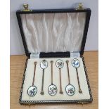 Cased set of Edwardian enameled spoons depicting floral scenes