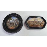 Two antique ceramic pot lids, both in ebonised wood frames (2)