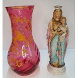 Early 20thC ceramic Maddona & child together with an antique cranberry glass vase (2)