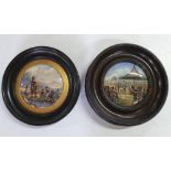 Two antique circular ceramic pot lids, one in ebonised wood frame the other in a fruit wood frame (