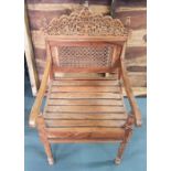 Finely carved Arabic wooden chair purchased by the owners in Oman