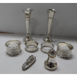 Group of old silver items to include bud vases (weighted bases), 4 napkin rings, a charming pin