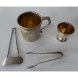 Four silver items to include an egg cup, small cup etc (4)