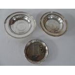 3 Edwardian circular silver shallow dishes, one with a small Scottie dog (3), 2 x 15cm dimeter, 1