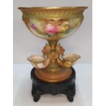 A Royal Worcester blush ivory ground porcelain centre piece in the form of a central bowl on a