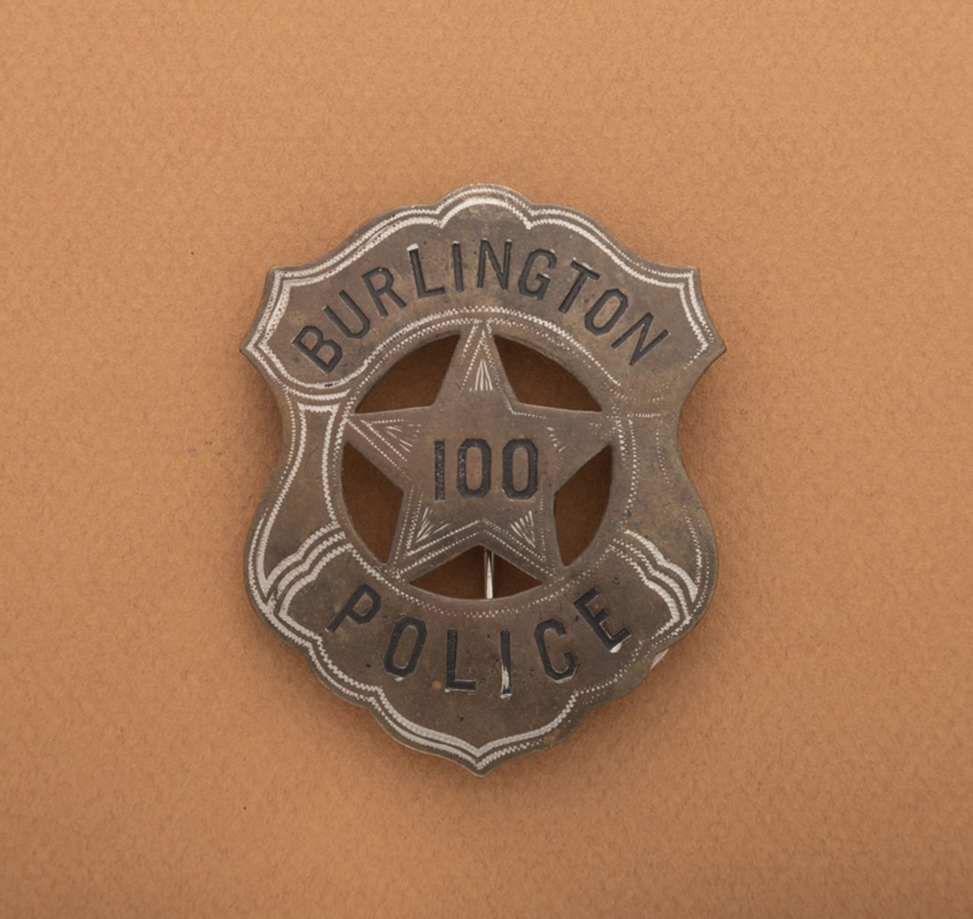 Burlington Police 100 Shield Badge, 2 3/4" tall, shield with cut out star. Hallmark "C.D. Reese / Ne