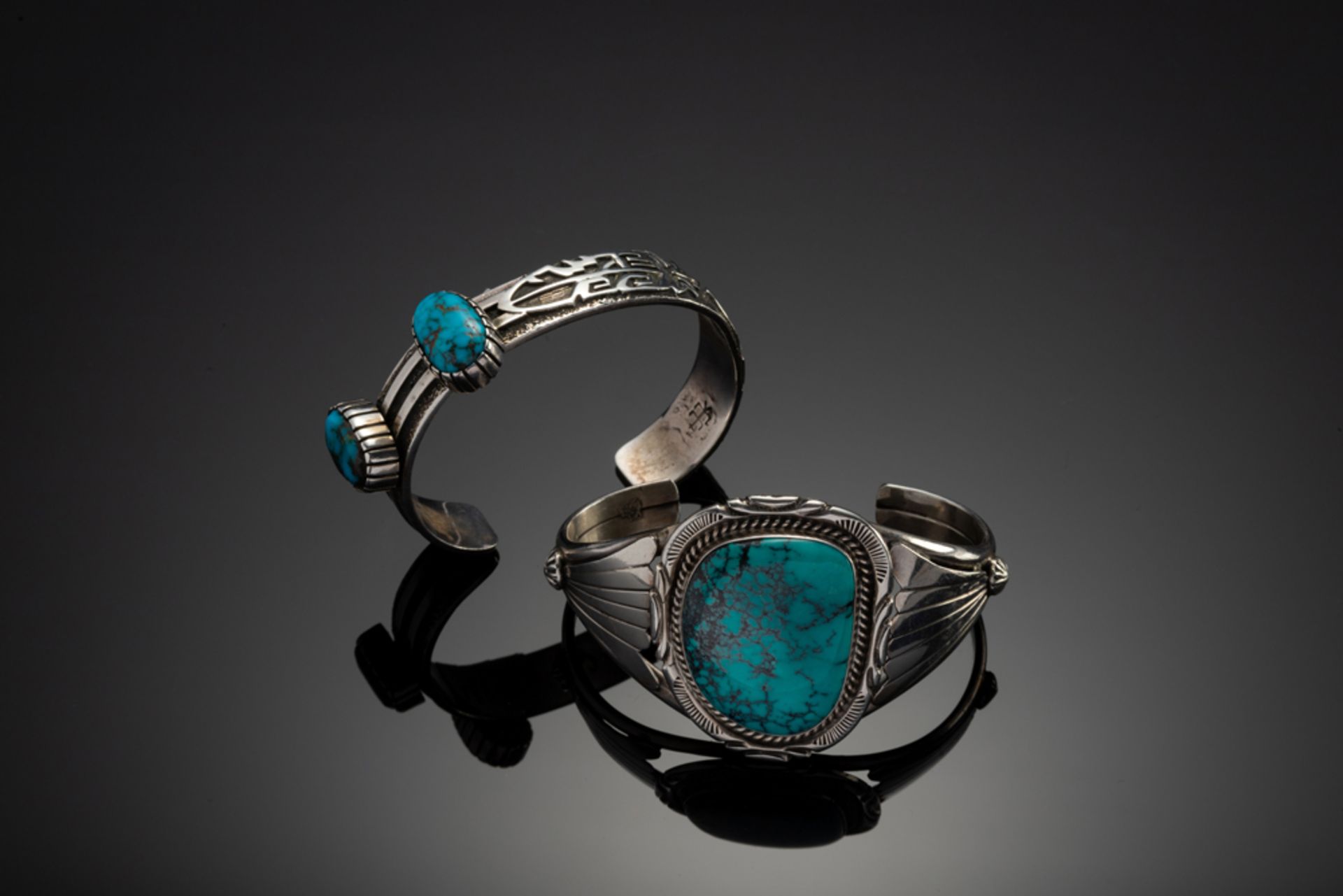 This consists of two Turquoise and Silver Cuffs. The large Cuff has maker mark ""M / Sterling"" with