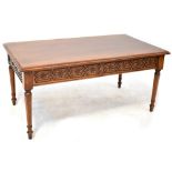A reproduction mahogany coffee table with blind cut frieze with two drawers,
