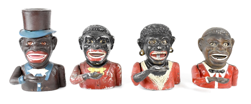 Four early/mid-20th century money boxes, two cast iron examples of a gentleman in period costume,