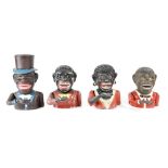 Four early/mid-20th century money boxes, two cast iron examples of a gentleman in period costume,