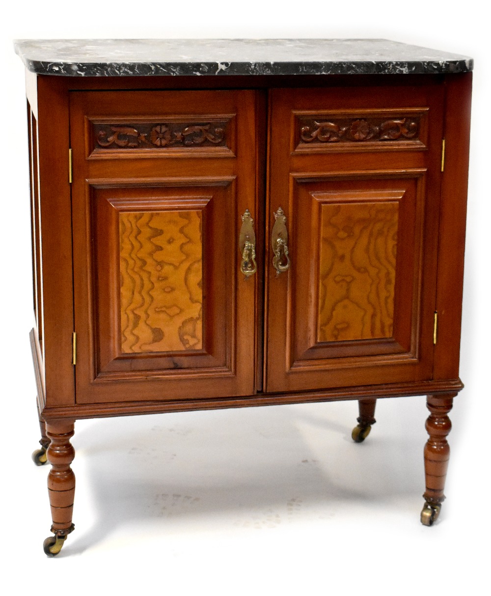 An Edwardian-style walnut marble-top wash stand with pair of carved panelled cupboard doors,