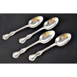 A set of four Victorian hallmarked silver scroll end dessert spoons, London 1848,