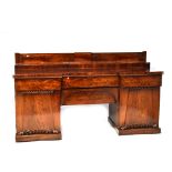An early Victorian flame mahogany pedestal buffet sideboard of large proportions,
