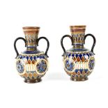 A pair of c1890 Doulton Lambeth twin-handled baluster vases, monogrammed ML for M.