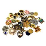 A quantity of costume jewellery, largely brooches.