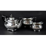 A Victorian hallmarked silver three-piece tea service, teapot, height 14cm, sucrier and milk jug,