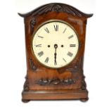 An early 19th century mahogany-cased bracket clock, the painted dial set with Roman numerals,