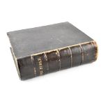 A large 19th century King James version of the Holy Bible containing the Old and New Testaments,