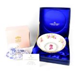 A boxed Coalport commemorative bowl decorated with pink roses and gilt-heightened,