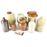 A quantity of early 20th century stoneware to include a whisky flagon, a large stoneware jar,