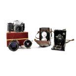 Various cameras and lenses comprising a Rolleicord Compur DRP camera,