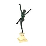 An Art Deco style cast metal figure of a dancing nude lady mounted on a pedestal base,