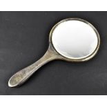 A George VI hallmarked silver hand mirror, Birmingham 1945, William Aitkin.