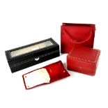 Cartier; a red watch box, pouch and bag, also a watch storage case for five watches (4).