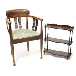 An Edwardian inlaid mahogany open elbow chair with pierced splats and drop-in seat,
