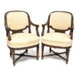 A pair of 19th century carved walnut open armchairs with gadrooned and acanthus leaf detail,