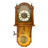 A late 19th century Vienna-style wall clock, the gilded dial with raised scroll decoration,