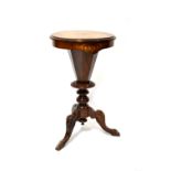 A Victorian inlaid walnut trumpet table with chessboard top and fitted interior for sewing,