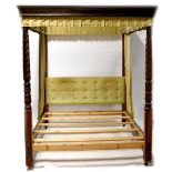 A mahogany four-poster bed with a dentil moulded open canopy,