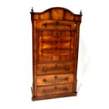 A Victorian mahogany escritoire with arched top above four drawers and a pull-down flap with fitted