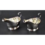 A pair of George V hallmarked silver sauce boats, Edinburgh 1928, Hamilton & Inches,