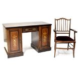 An Edwardian inlaid rosewood kneehole desk comprising single drawer and pair of cupboard doors with