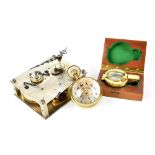 An Elgin Incabloc brass and glass ball clock, the dial set with Arabic numerals,