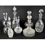 Seven 19th and 20th century glass decanters to include a Cluck-Cluck example with white metal