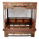 An impressive Chinese carved and gilded wedding bed,