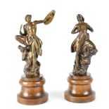 A pair of late 19th century bronzed female and male warrior figures,