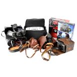 A quantity of cased cameras to include a Six-20 'Brownie E' Kodak, a Halina camera,
