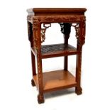 An Oriental stained hardwood jardinière stand with rectangular top,