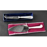 A boxed silver handled cheese knife, Sheffield, marked 925, and a boxed silver handled cake slice,