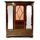 An Edwardian inlaid mahogany triple compactum wardrobe,