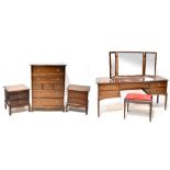 A Stag Minstrel part bedroom suite comprising dressing table with triptych mirror attached,